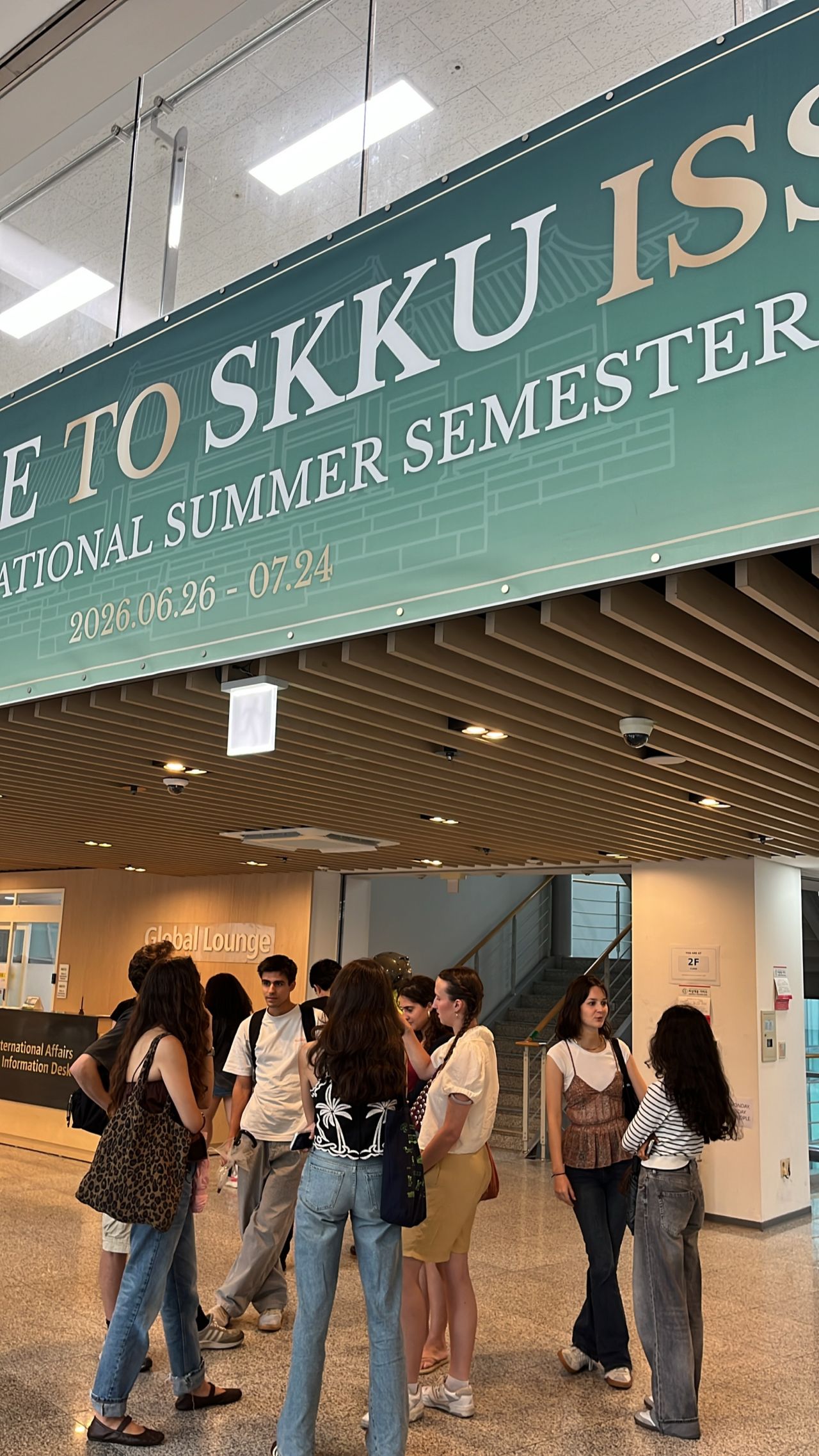 Visitors gather beneath an SKKU International Summer Semester banner.